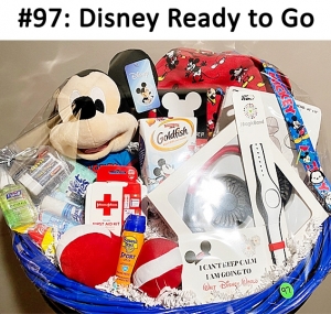 Disney backpack, Mickey Mouse plush, Disney magic band, neck fan, poncho, first aid kit, suntan lotion, and assorted travel supplies.

Total basket value: $128.00