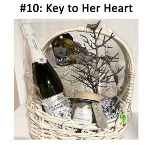 This basket includes a jewelry tree, candle, purse, wine, scarf, and necklace.