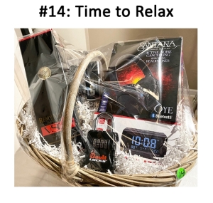This basket includes headphones, alarm clock, wine, wireless lock, and a speakerphone.