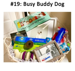 This basket includes a picture frame, socks, bag, gift card, and various dog care items.