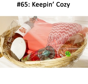 This basket includes a bracelet, bag, scarf, wine, Cherry Blossom mist, jewelry tray, hand soap, and a wine glass.