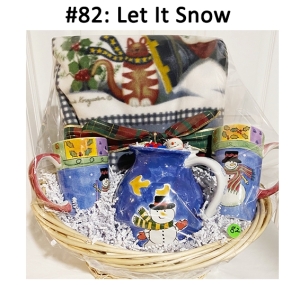 This basket includes a pitcher, mugs, blanket, and ornament.